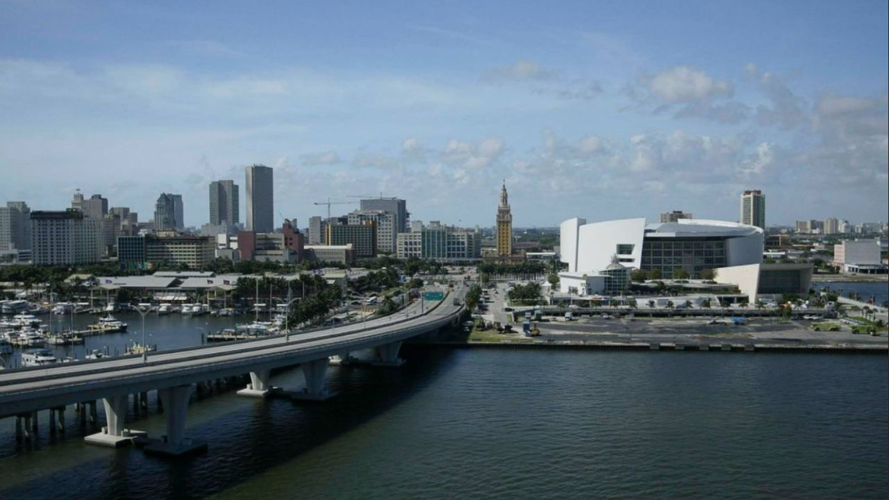Downtown Miami skyline with bridge and waterfront view during the day