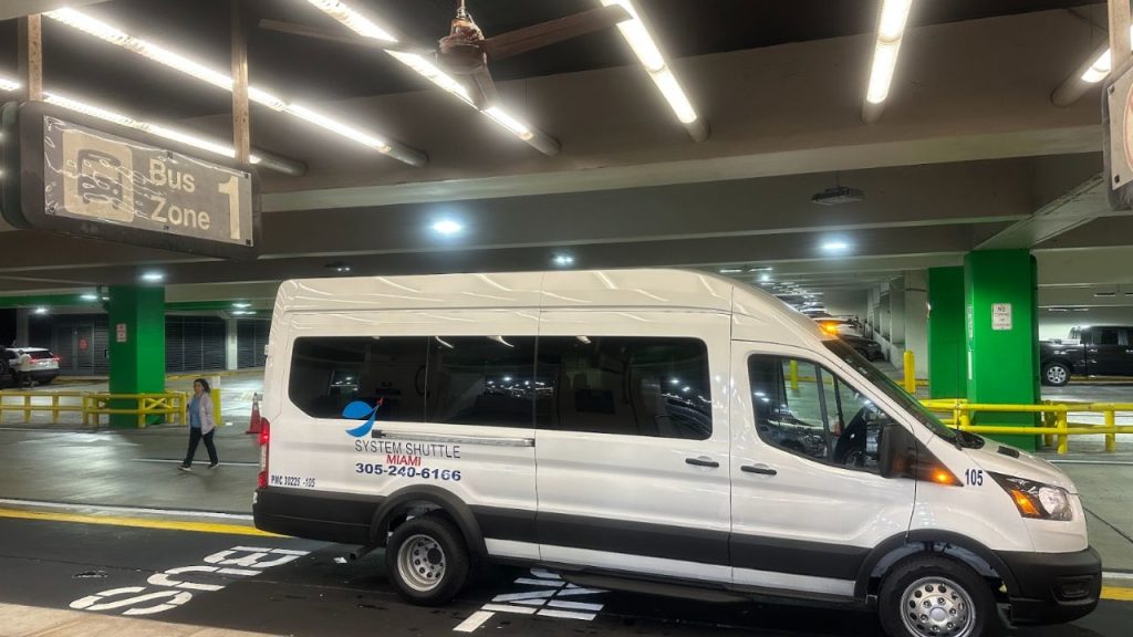System Shuttle Miami van parked at a pickup zone