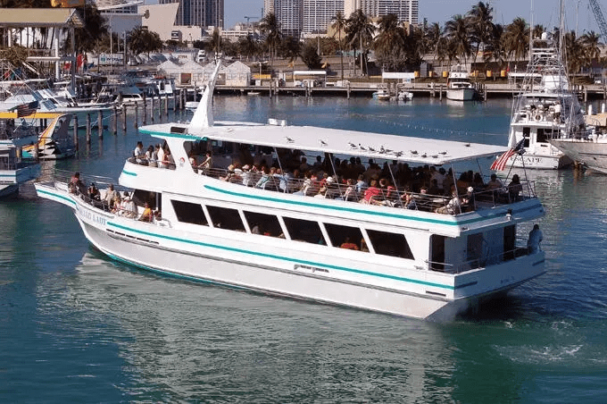 Miami sightseeing boat tour with tourists in marina