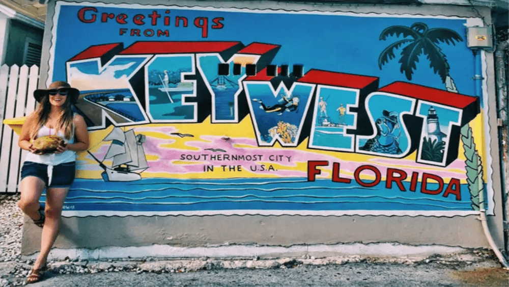 Tourist at Key West Florida mural southernmost city landmark