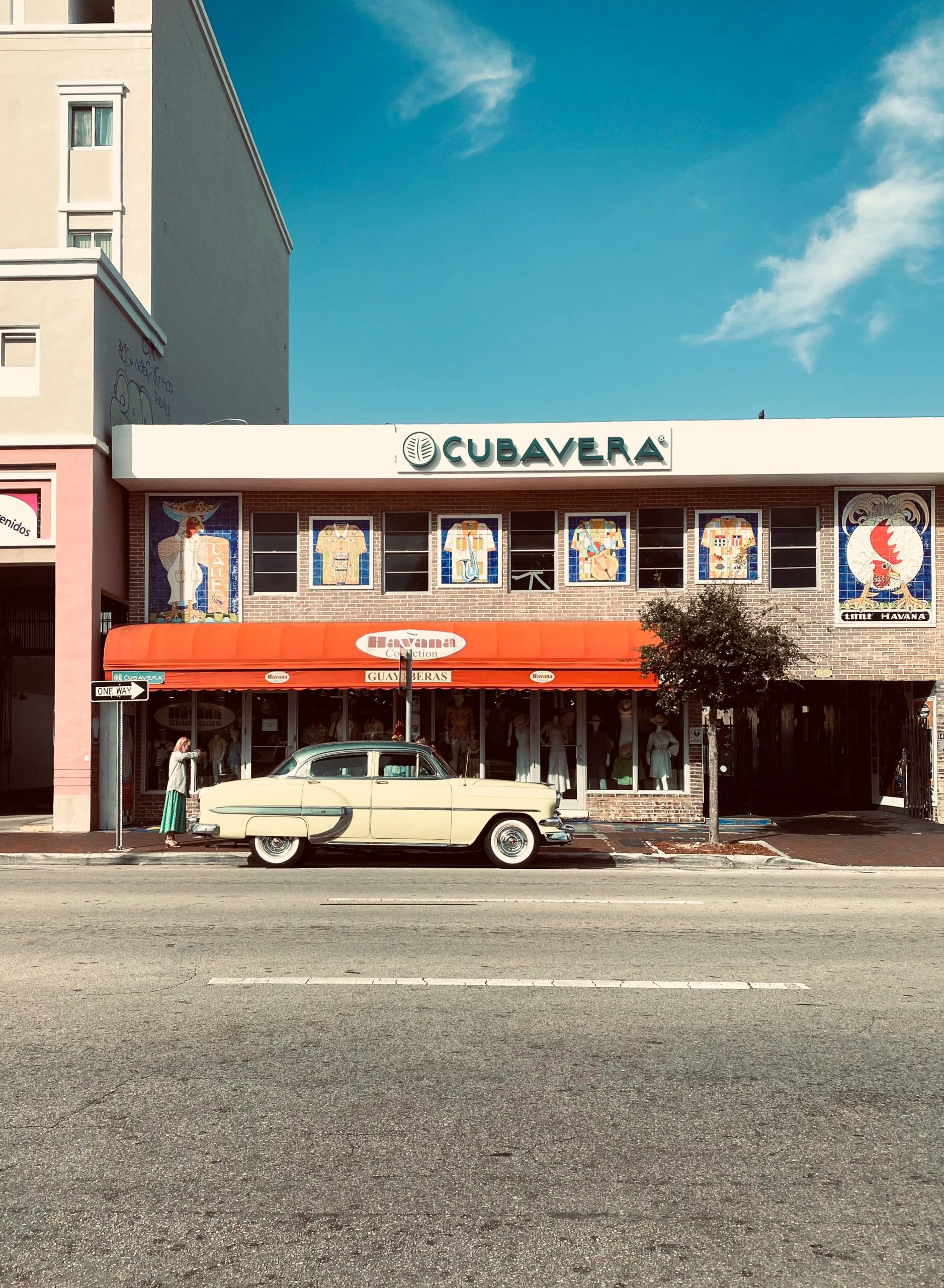 Historic storefront and classic vintage car along Calle Ocho in Little Havana, Miami