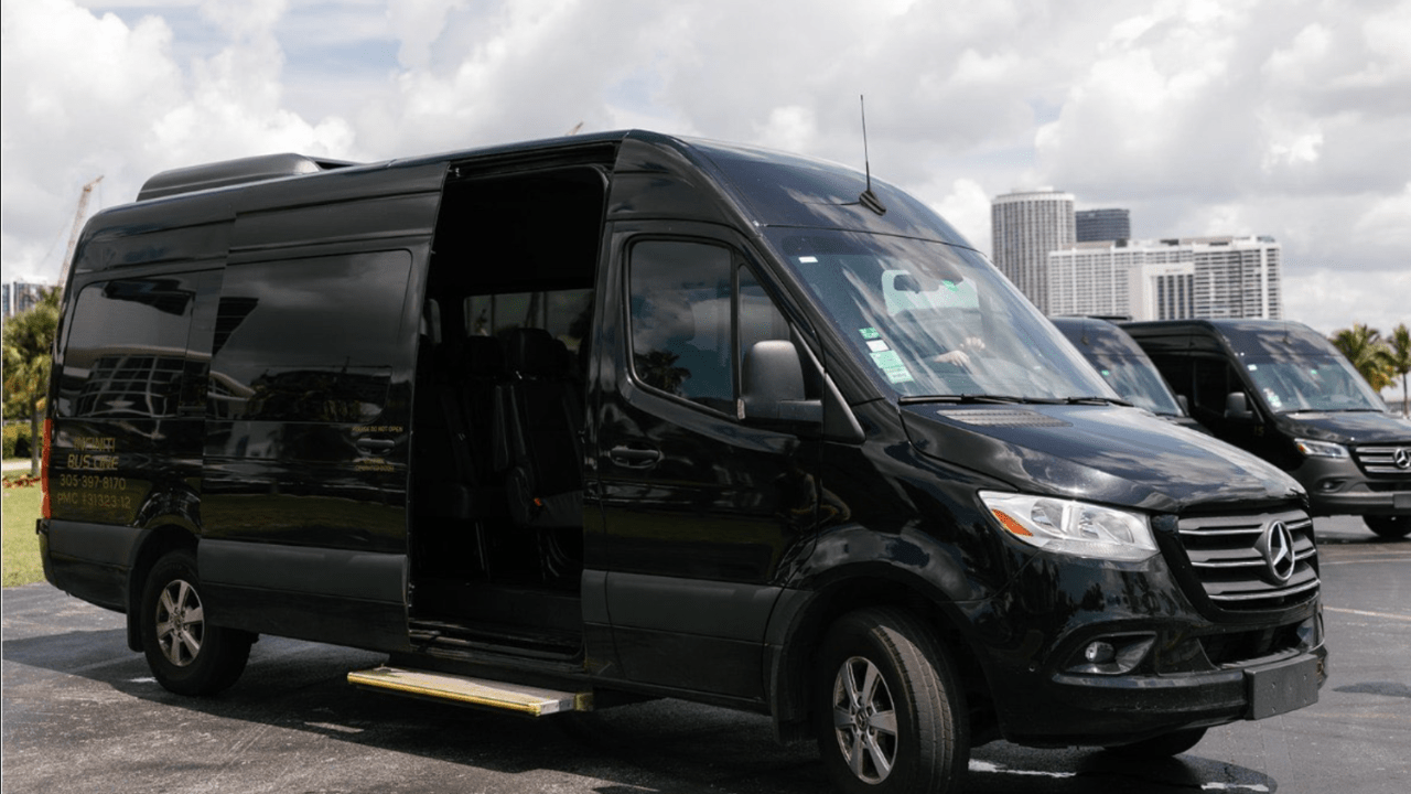 Luxury black sprinter van providing group transportation in downtown Miami.
